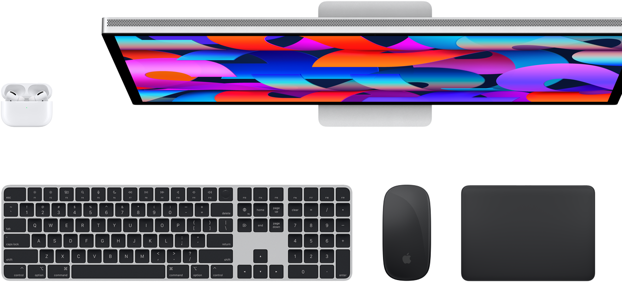 Top view of AirPods, Studio Display, Magic Keyboard, Magic Mouse, and Magic Trackpad.